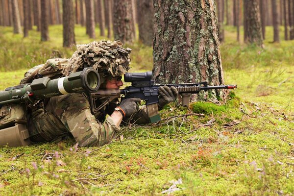 The Danish army and soldiers with weapons in the forest