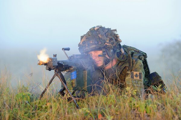 A Canadian Army soldier is firing