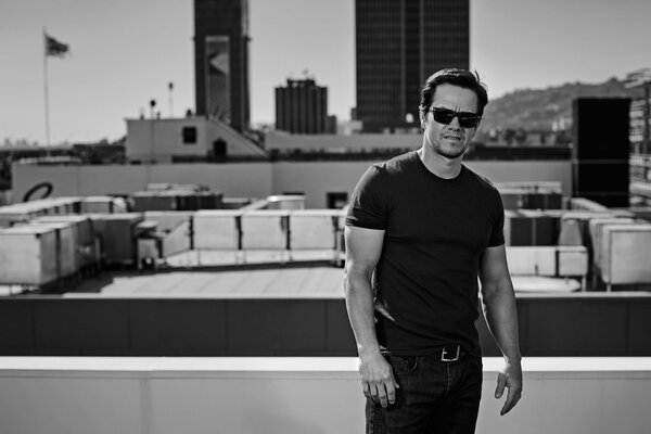 Black and white shot of the actor on the roof