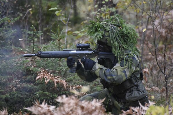 In the Swedish army , a soldier with a gun