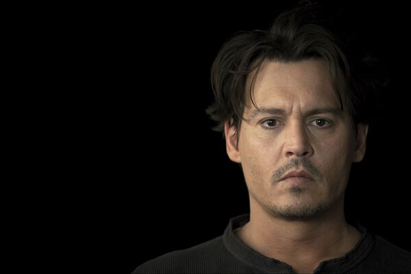 Johnny Depp on a black background