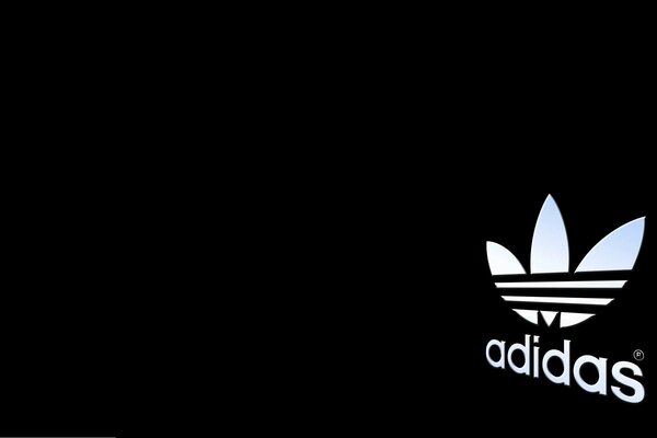 Adidas Firmenlogo auf schwarzem Hintergrund