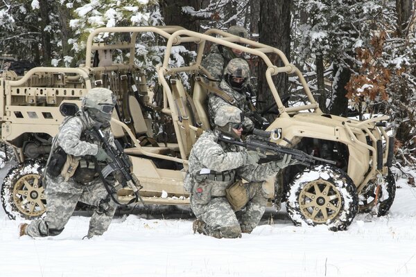 Army of soldiers with machine guns in winter