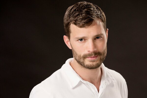 Jamie Dornan smiles sweetly