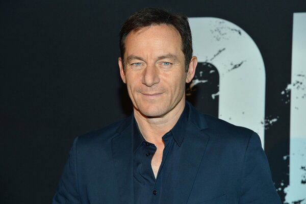 Photo de Jason Isaacs sur fond sombre