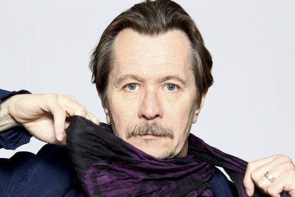 On a white background image of Gary Oldman