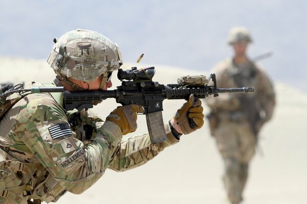 Soldiers with weapons. Shooting, army