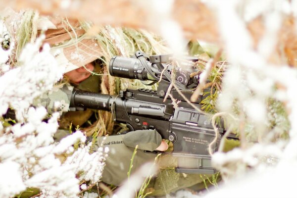 A masked soldier with a gun. Army