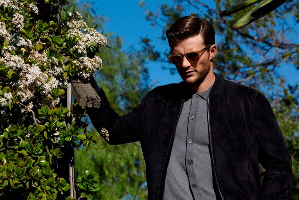 Scott Eastwood poses for a magazine. Photo shoot in nature