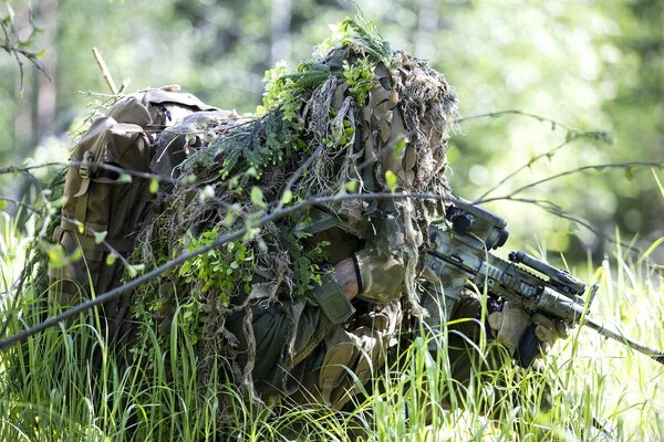 In the army, a soldier is photographed with a weapon