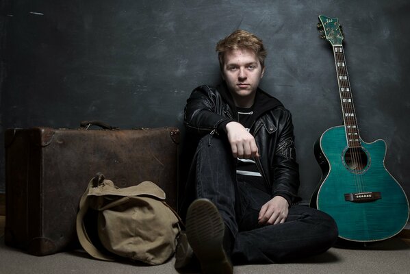 Photo shoot of a musician guy with a guitar