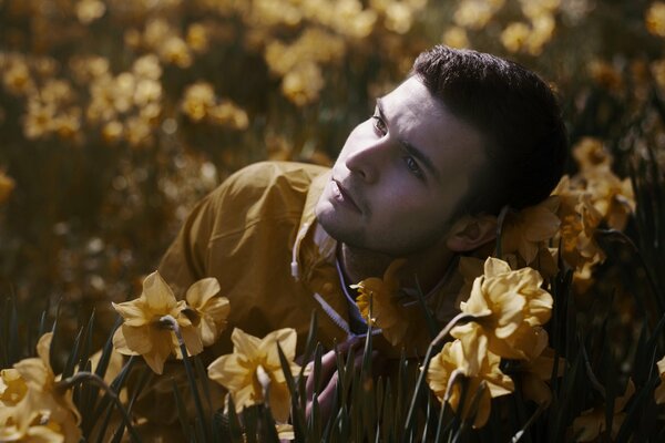 Portrait of a man in a field with flowers