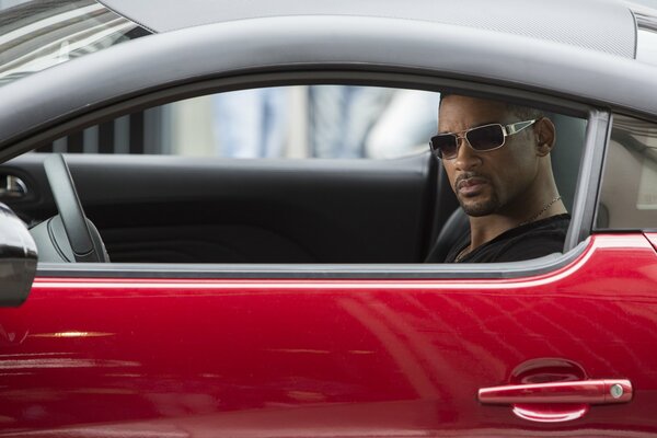 Will Smith in the red car