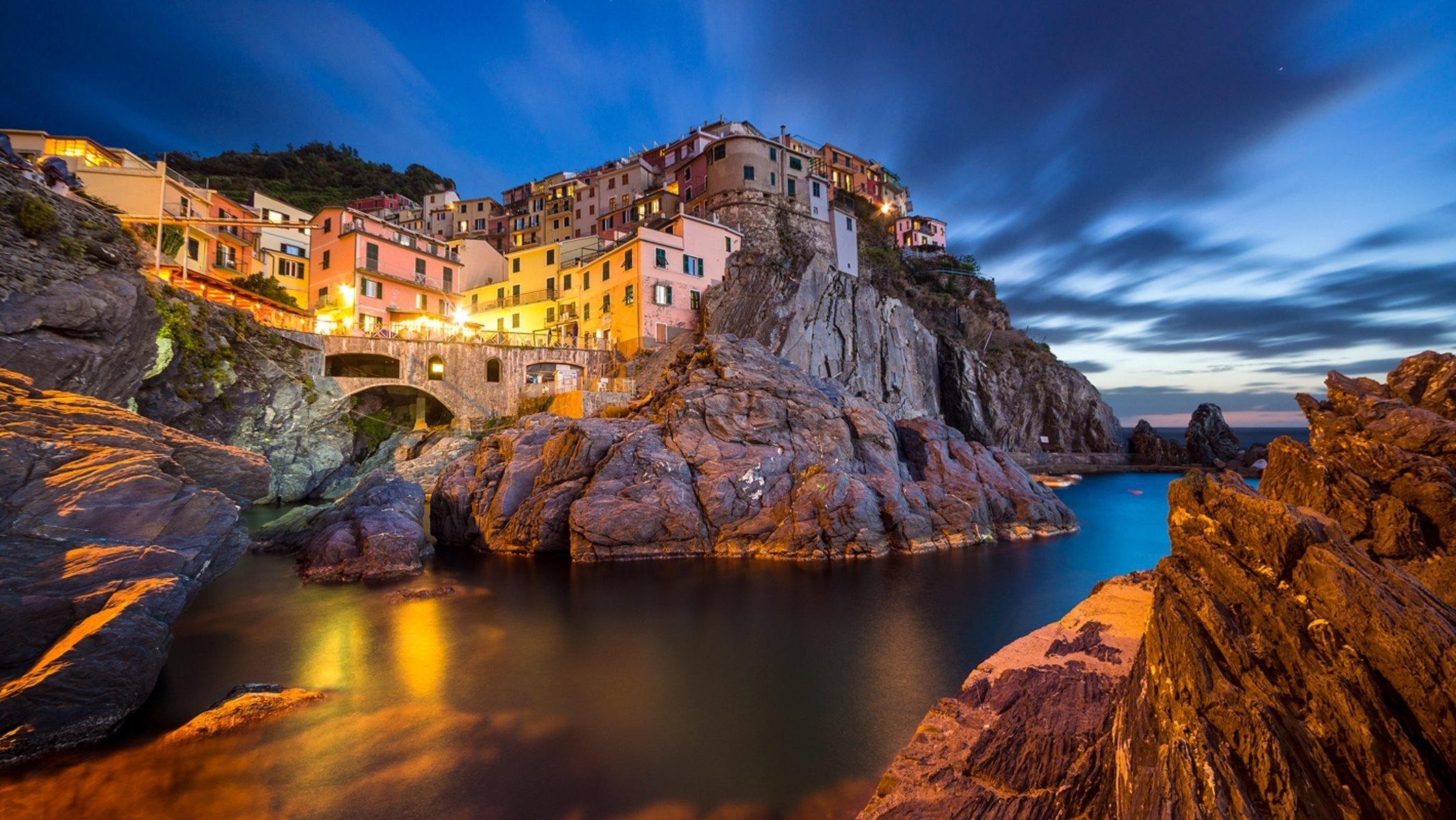 city on a rock manarola italy sea the sky light