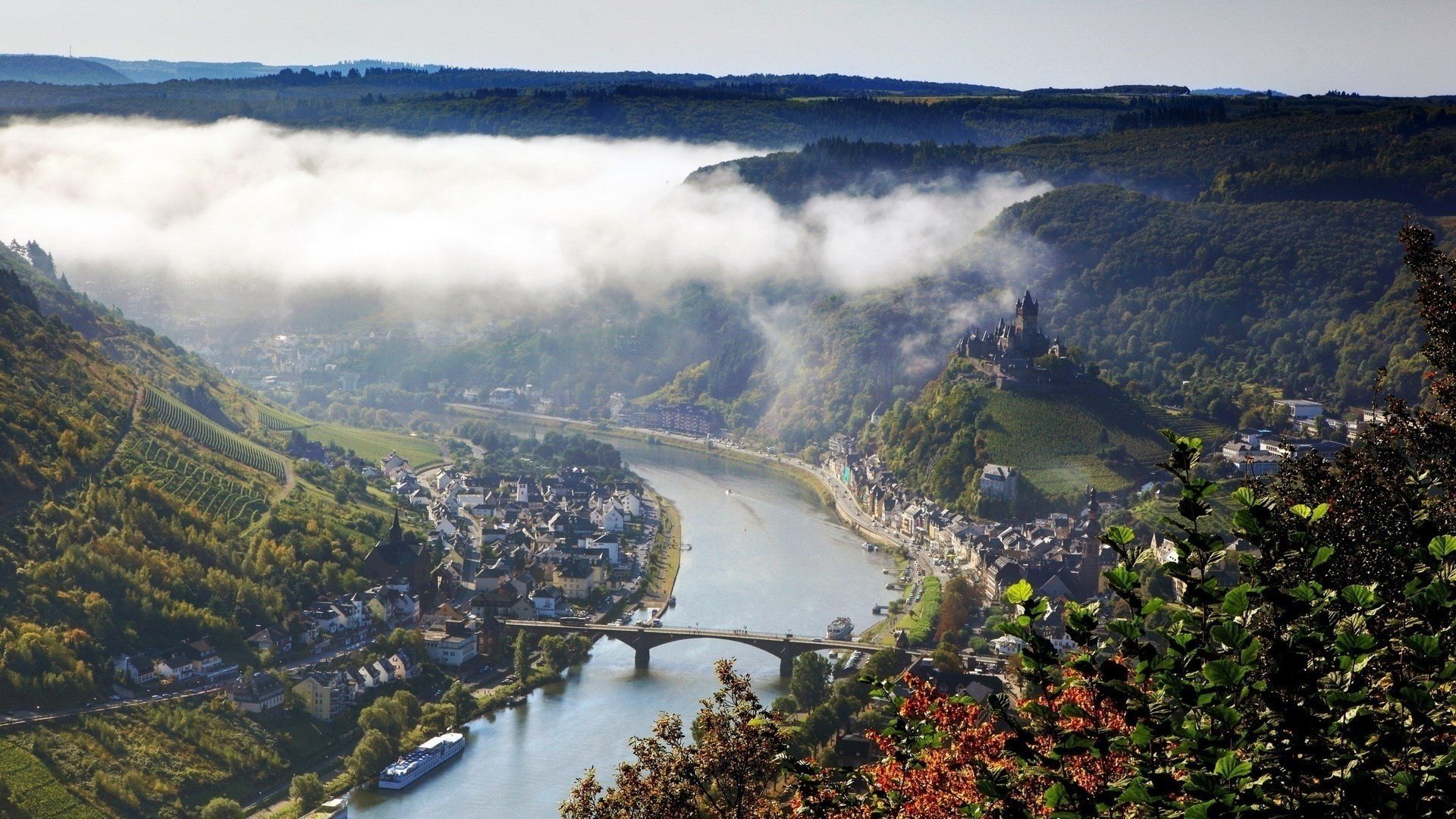 the city mountains river bridge fog beautiful