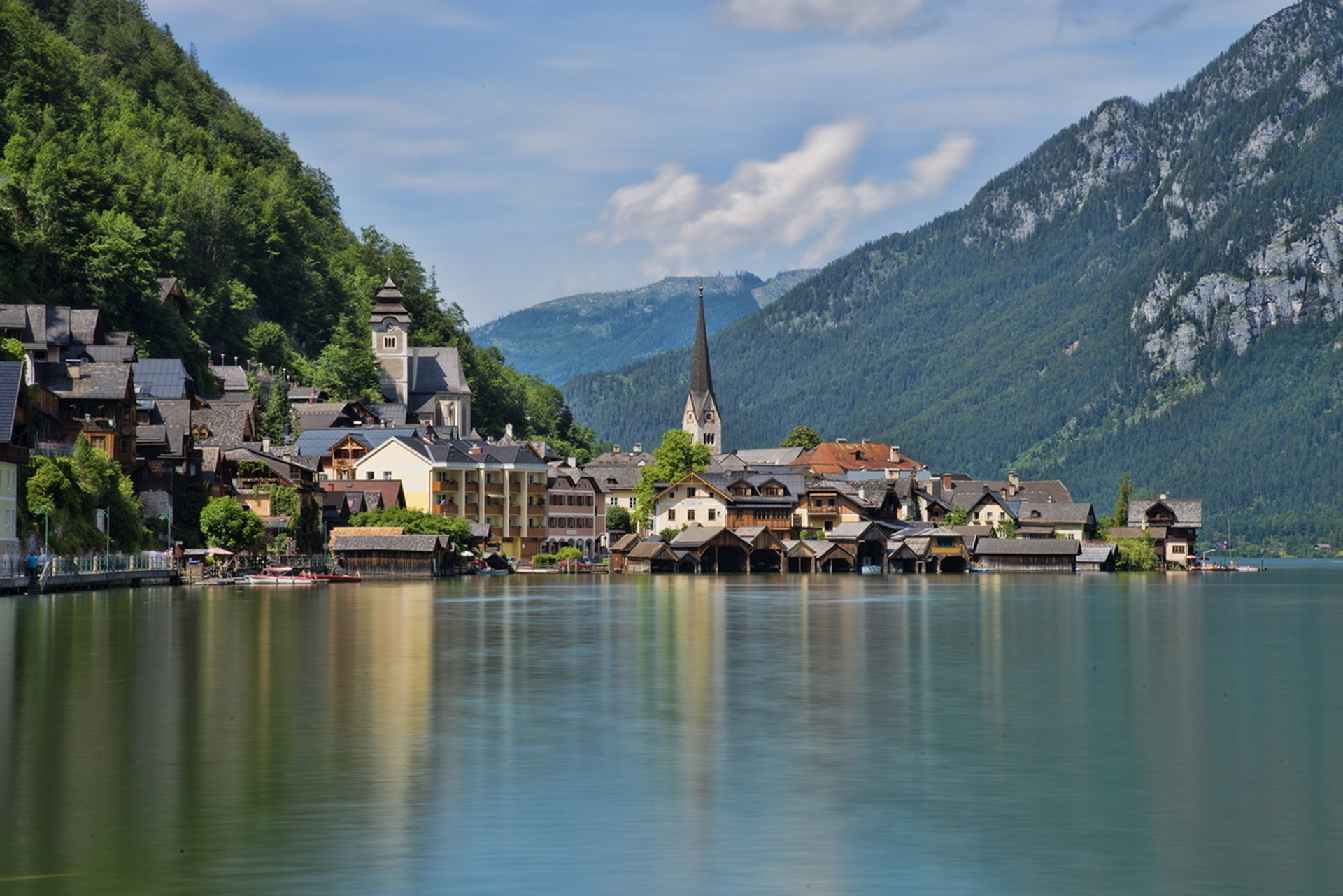 hallstatt lake hallstatt austria the city houses building lights reflection surface mountains the sky