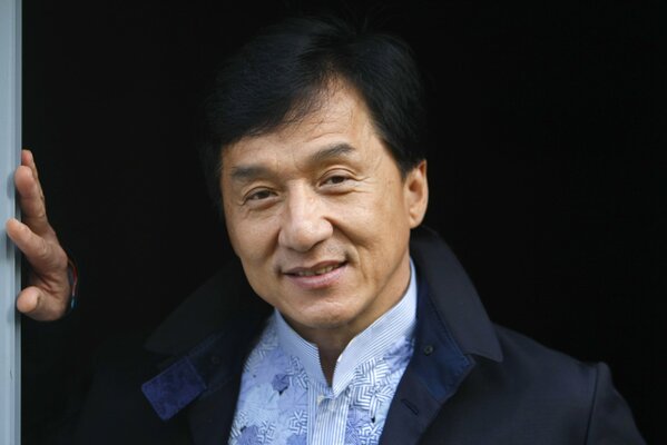 The famous Jackie Chan in a blue shirt