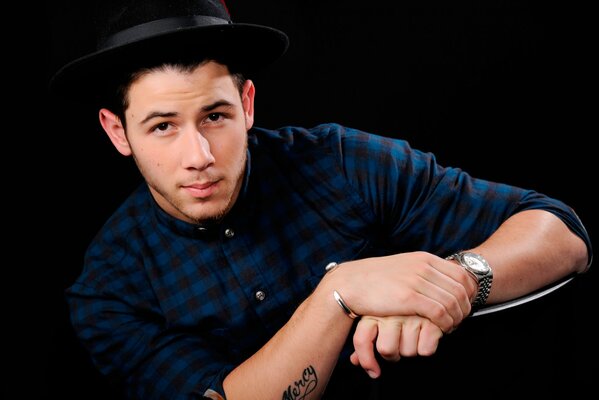 Nick jonas singer photo in a hat