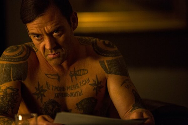 The Great Equalizer with tattoos