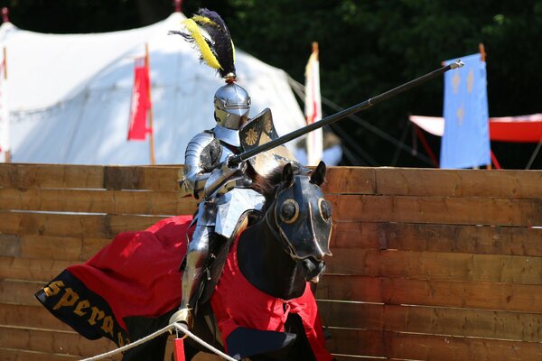 A knight in armor riding a horse