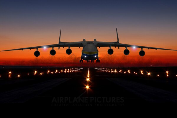 AN AN 225 aircraft on the runway, at sunset