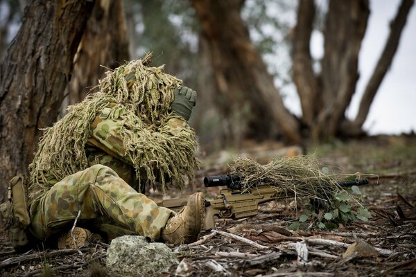 Army. A soldier looks through binoculars