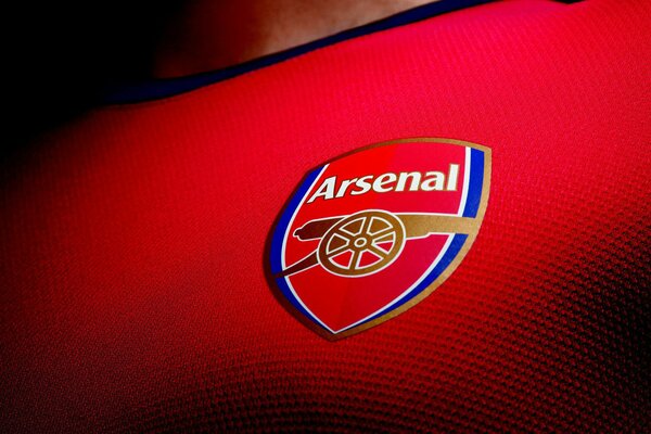 Emblema del Club Arsenal sobre fondo rojo