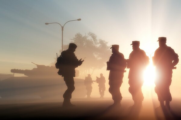 Silhouettes of soldiers serving in the army in the light