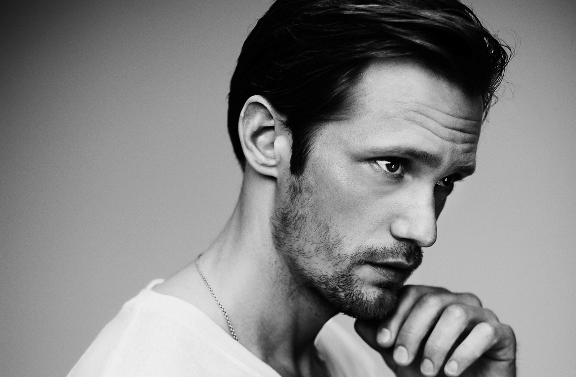 alexander skarsgard men face view hand black and white