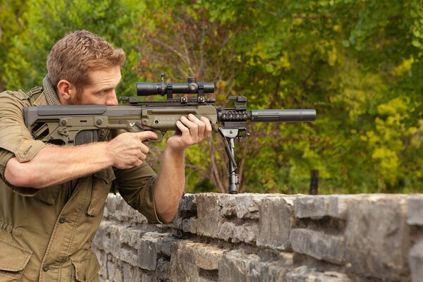 KEL-tec rfb rifle on a green background