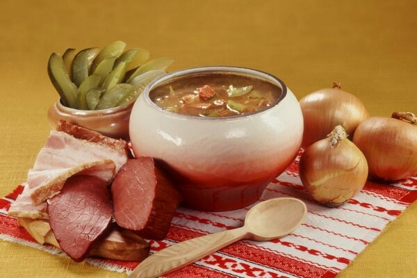 Ukrainian lunch, borscht with bacon on meat with onions