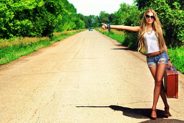 Girl hitching a ride in nature