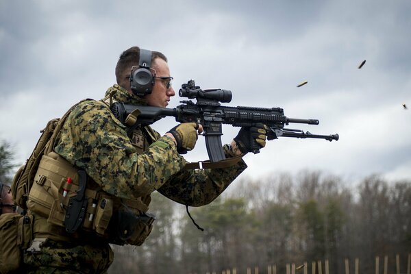 An infantry automatic rifle in the sights of a man