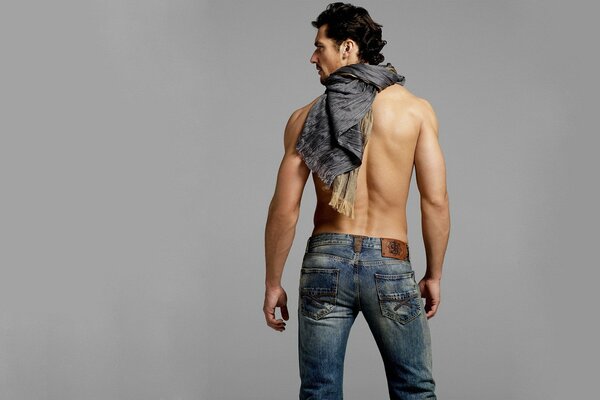 Photo of a man in jeans from the back