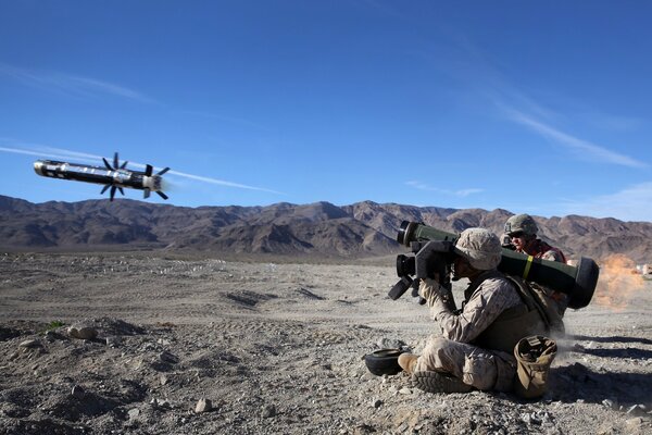 A soldier with a live projectile fired