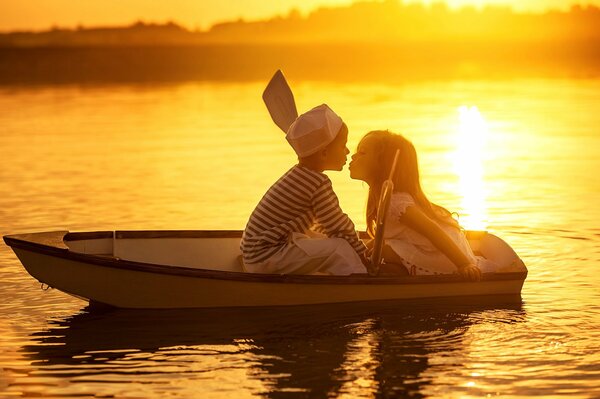 On the boat he and she look at each other waiting for something