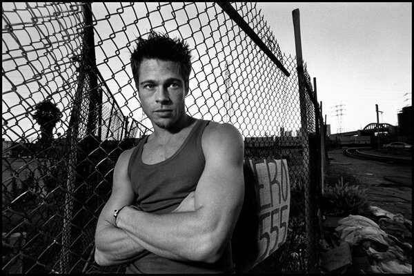 Brad Pitt at a photo shoot near the fence