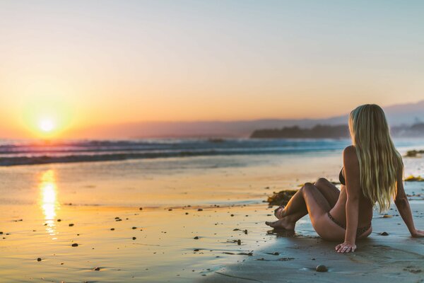 Girl in lingerie admiring the sea