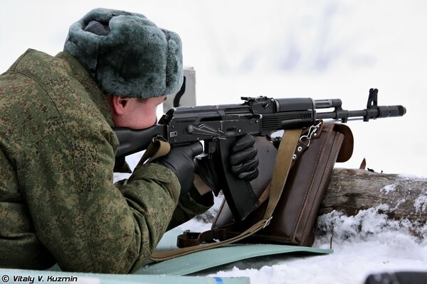 A soldier on a shooting range wearing a hat