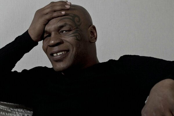 Boxer Mike Tyson smiles