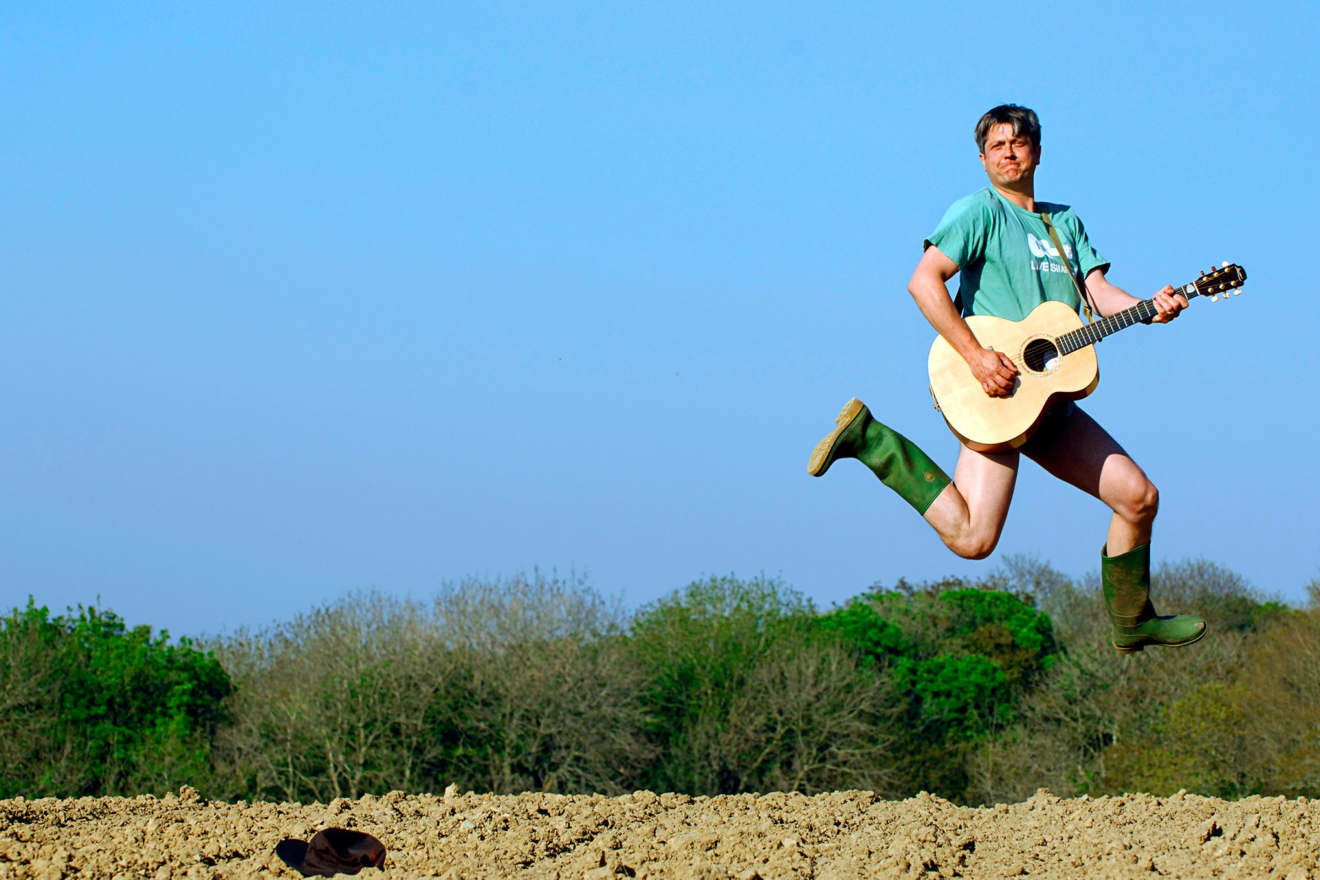 men a man with a guitar guitars jump