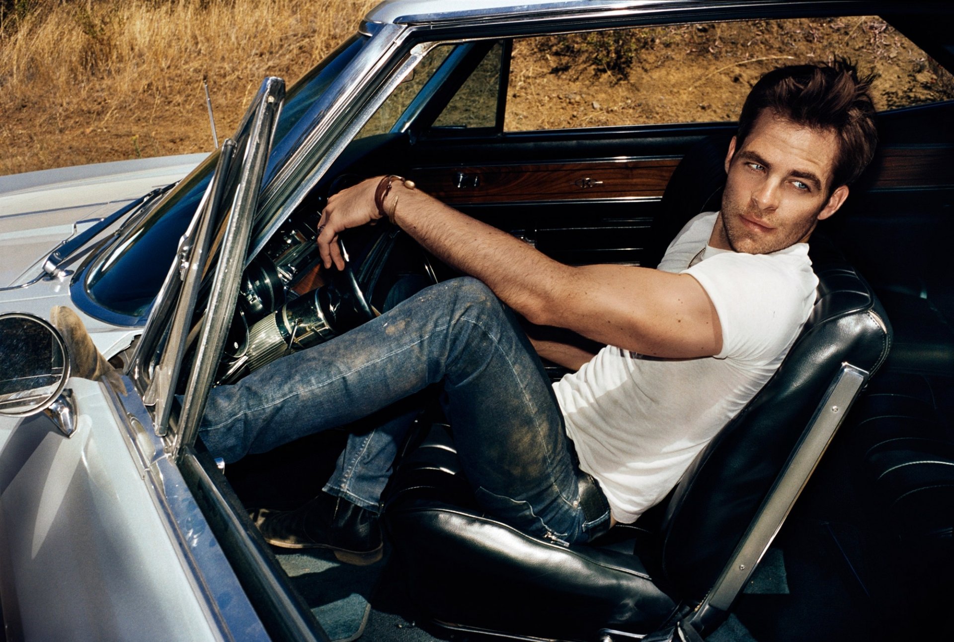 chris pine actor men view t-shirt jeans sitting machine seat