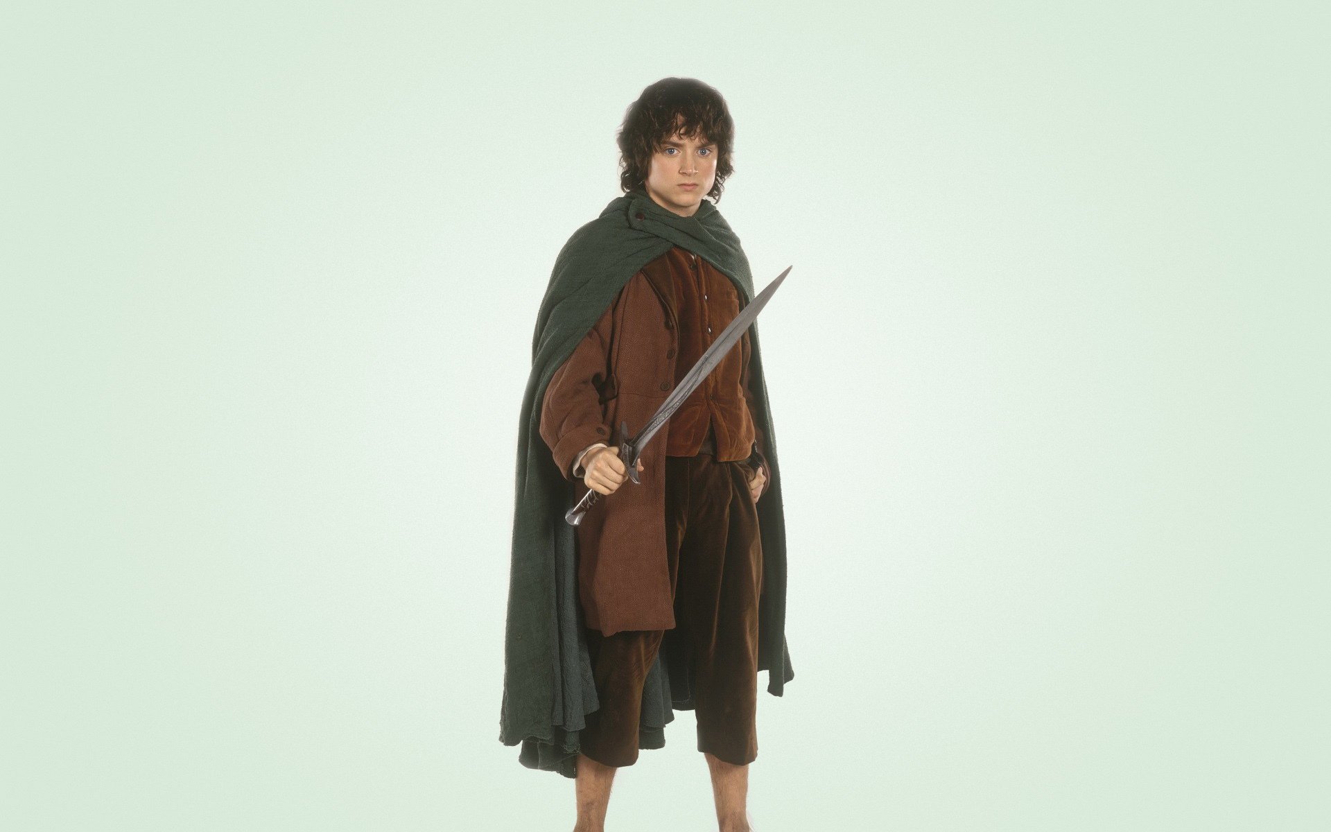 elijah wood miecz frodo baggins jasne tło władca pierścieni