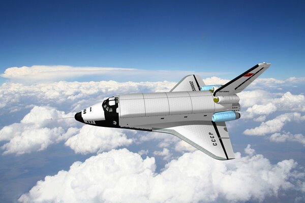 The plane buran over cumulus clouds