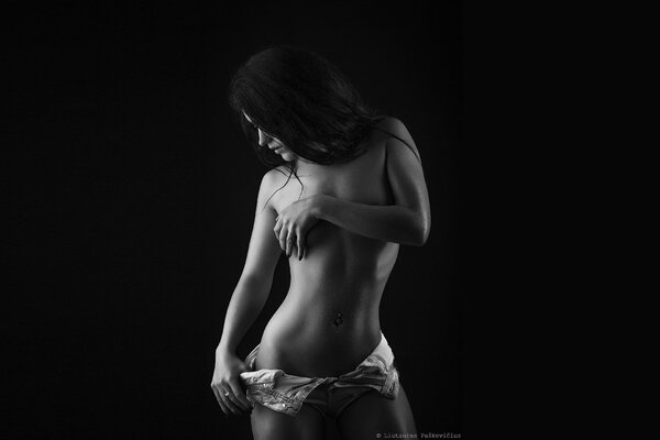 The play of light and shadow on the brunette s body