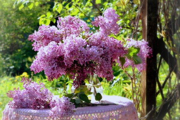 Spring bouquet of lilac on the table