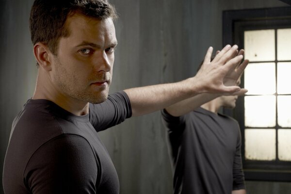 Actor Joshua Jackson and reflection in the mirror