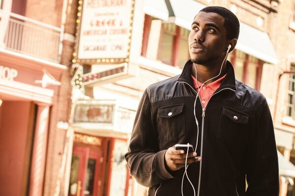 Nigga with iPhone and apple headphones