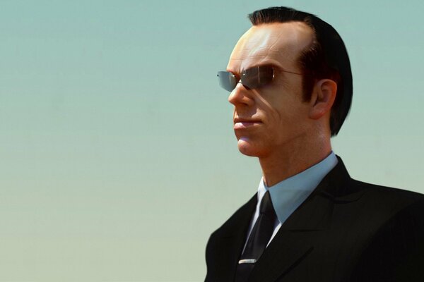 Agent Smith hat eine Brille und einen schwarzen Anzug