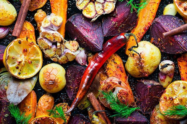 A mix of baked vegetables and citrus fruits